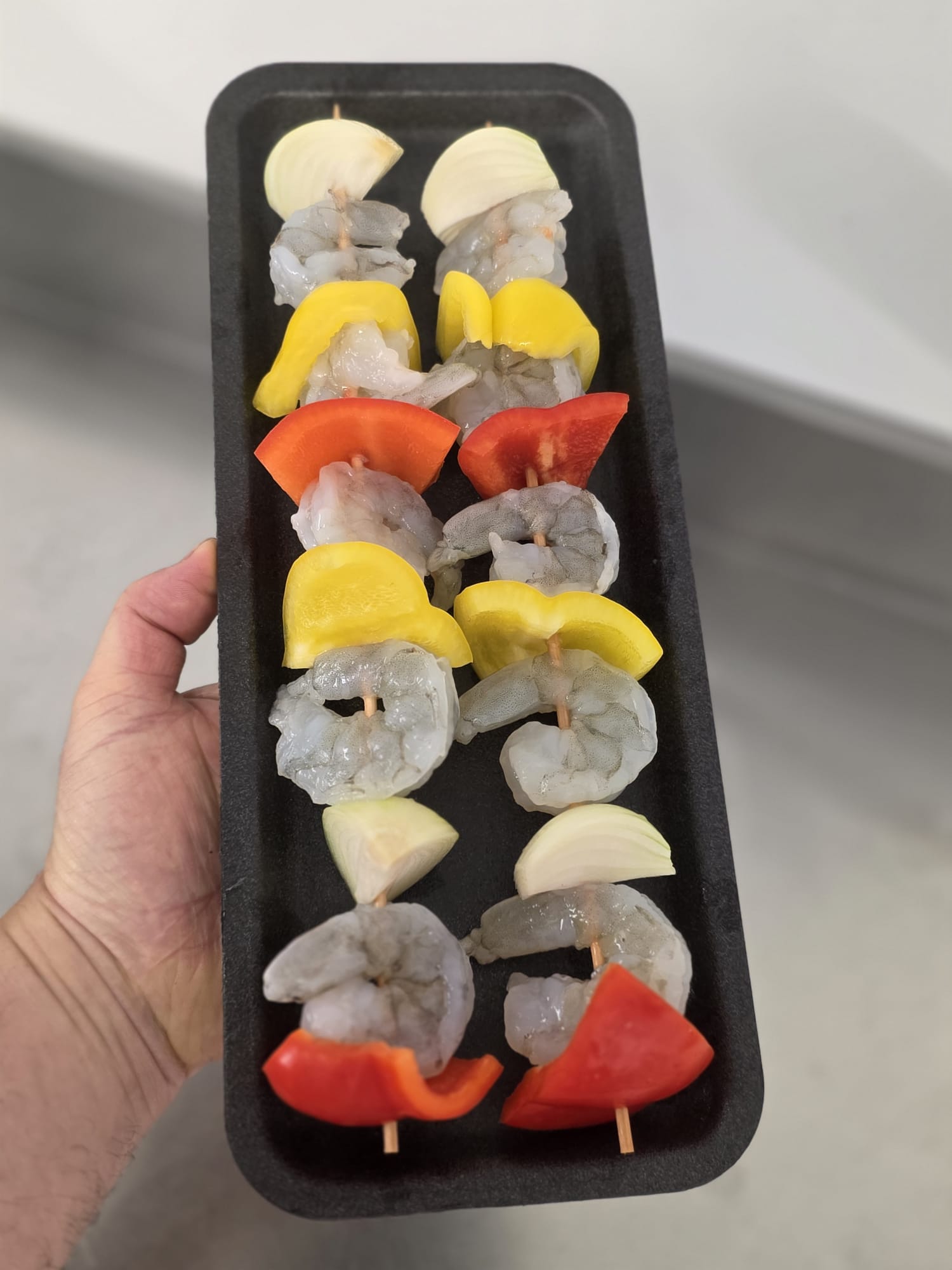 2 King Prawn Kebabs on a tray before cookin.