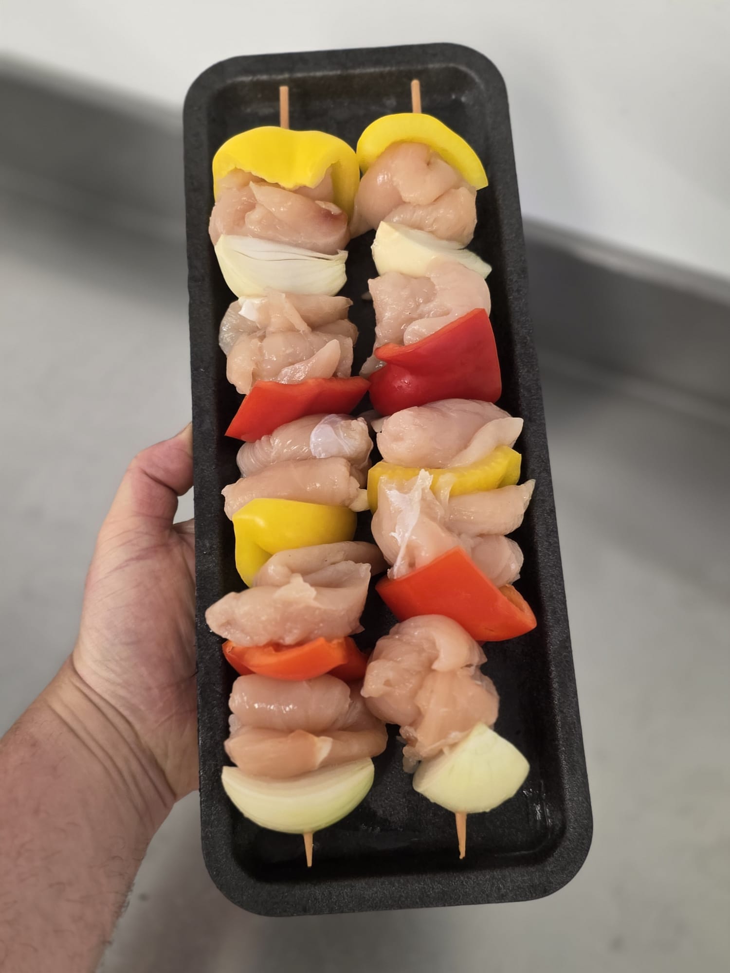 2 x chicken and veg kebabs before cooking.