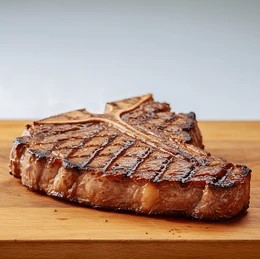 A big T bone steak cooked and ready to eat