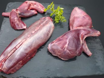 Joints of hare arranged neatly on a slate
